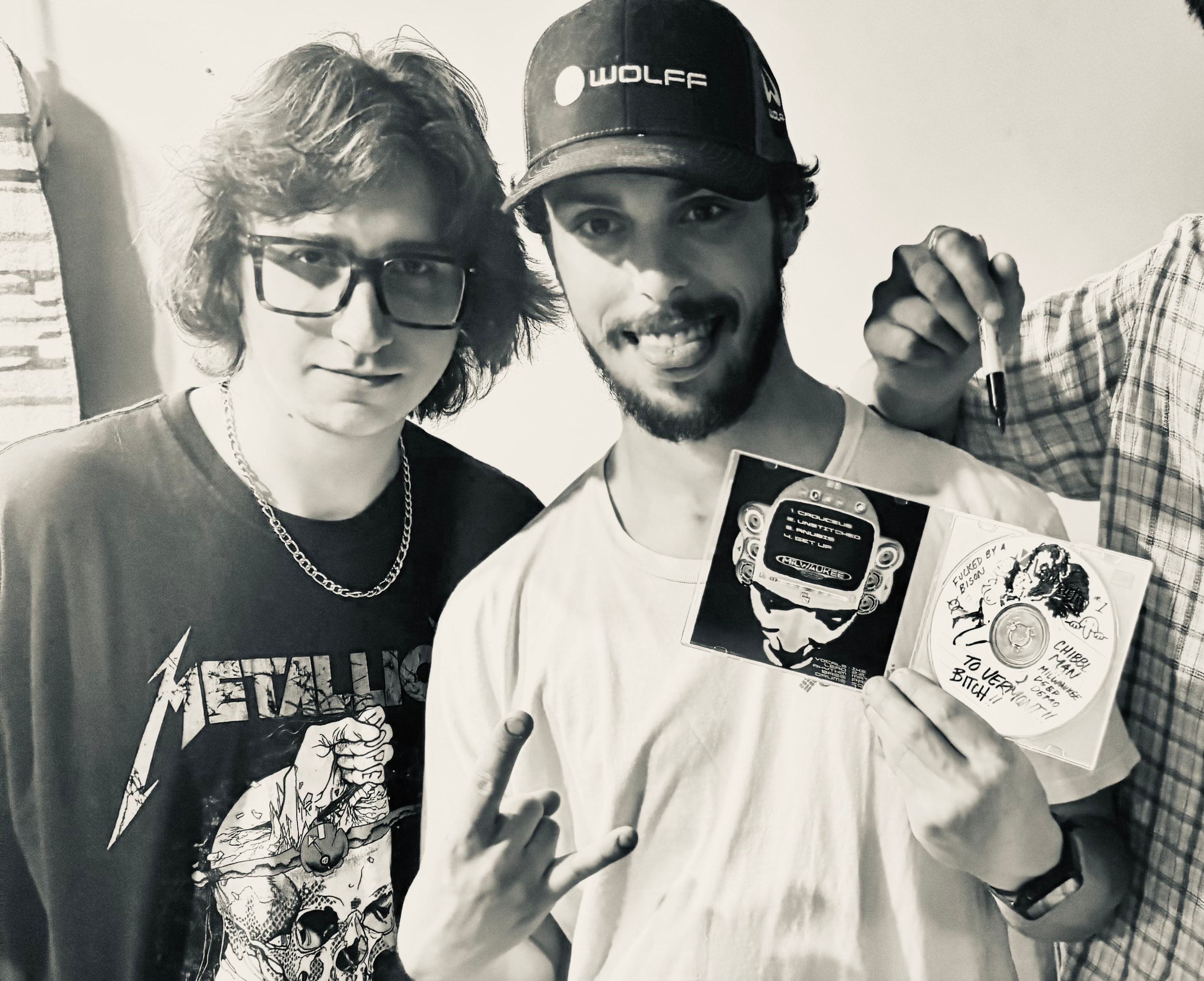 Fan holding a signed Milwaukee Deep Demo EP CD